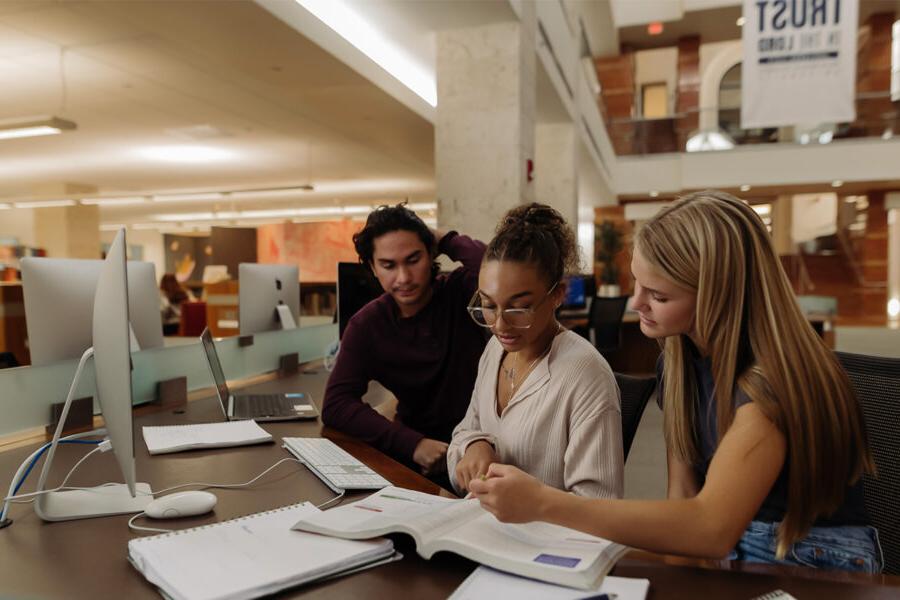 Philosophy and global development students study in the library